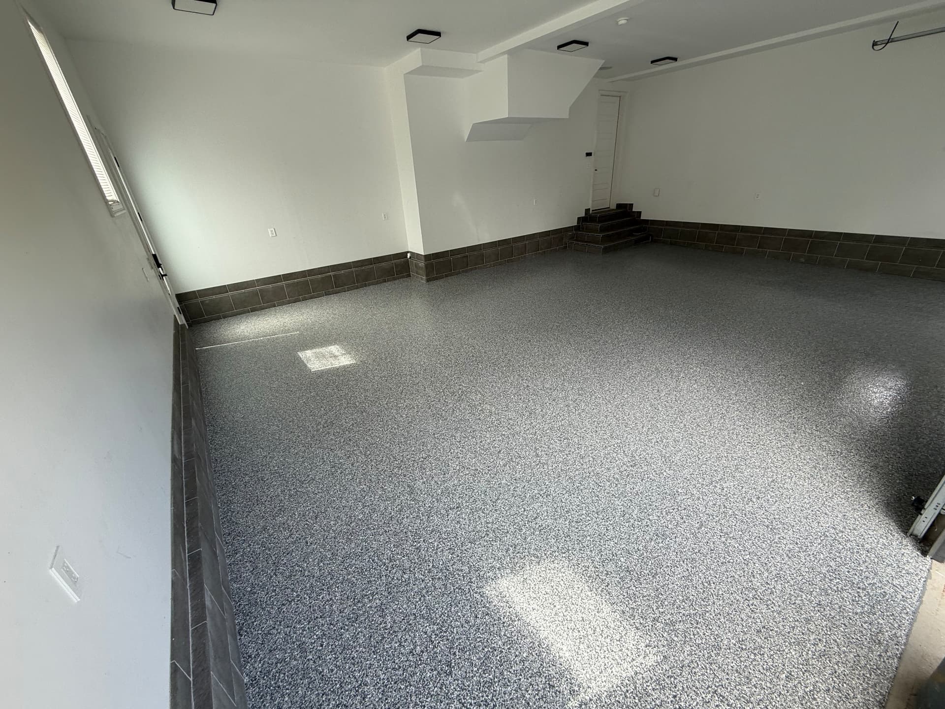 Completed gray flake garage floor coating in West Springfield, Massachusetts