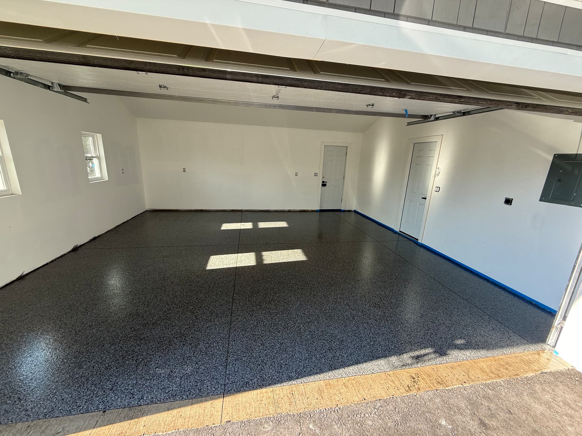 Completed full-flake garage floor coating in Southwick, Massachusetts