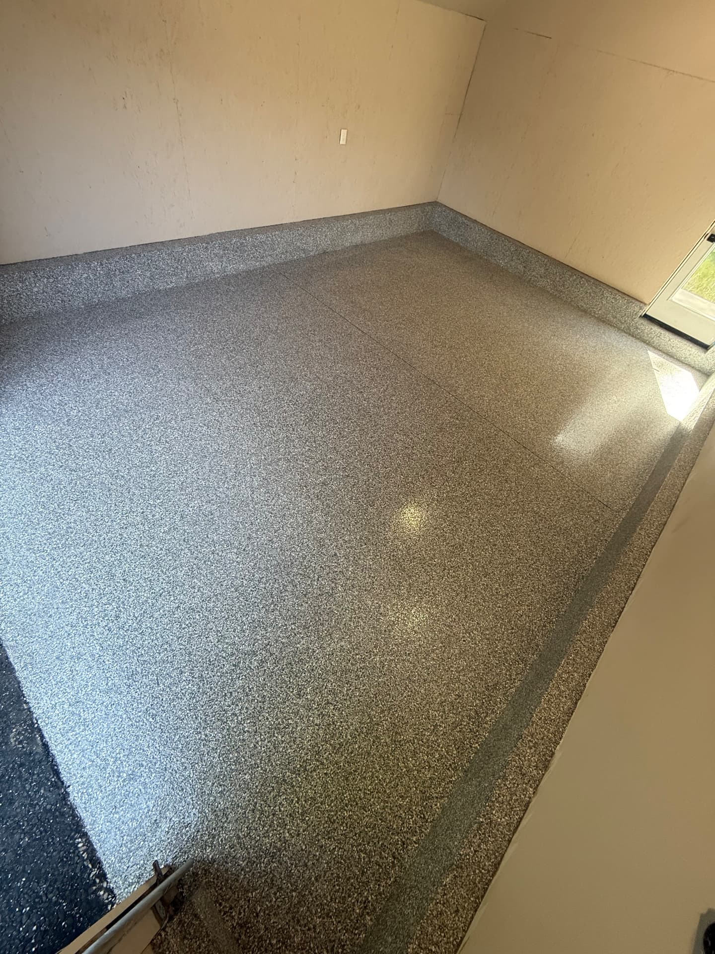 Showroom package flake epoxy garage floor with coated stem walls in Westfield, MA