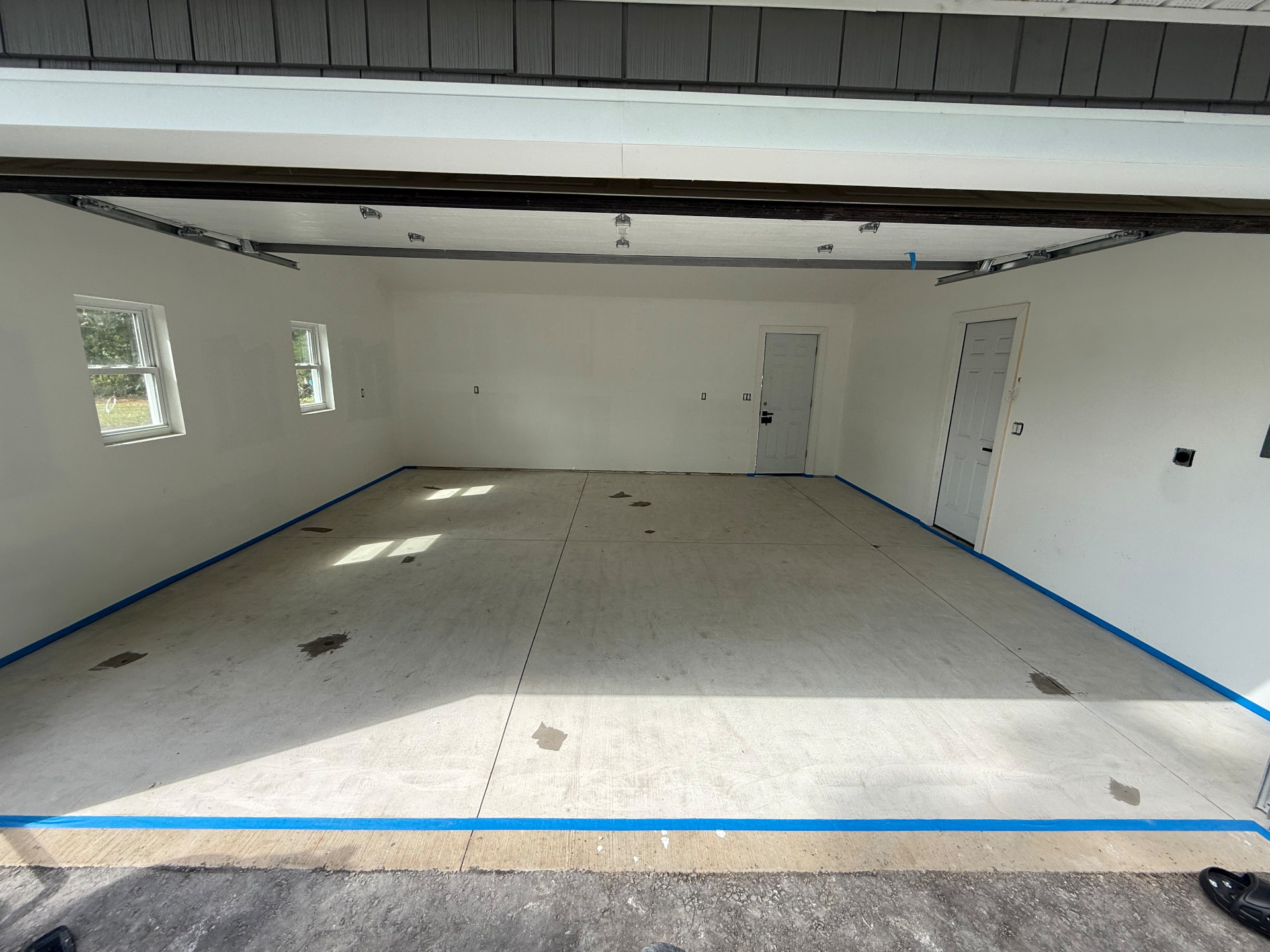Bare concrete garage floor before coating in Southwick, Massachusetts